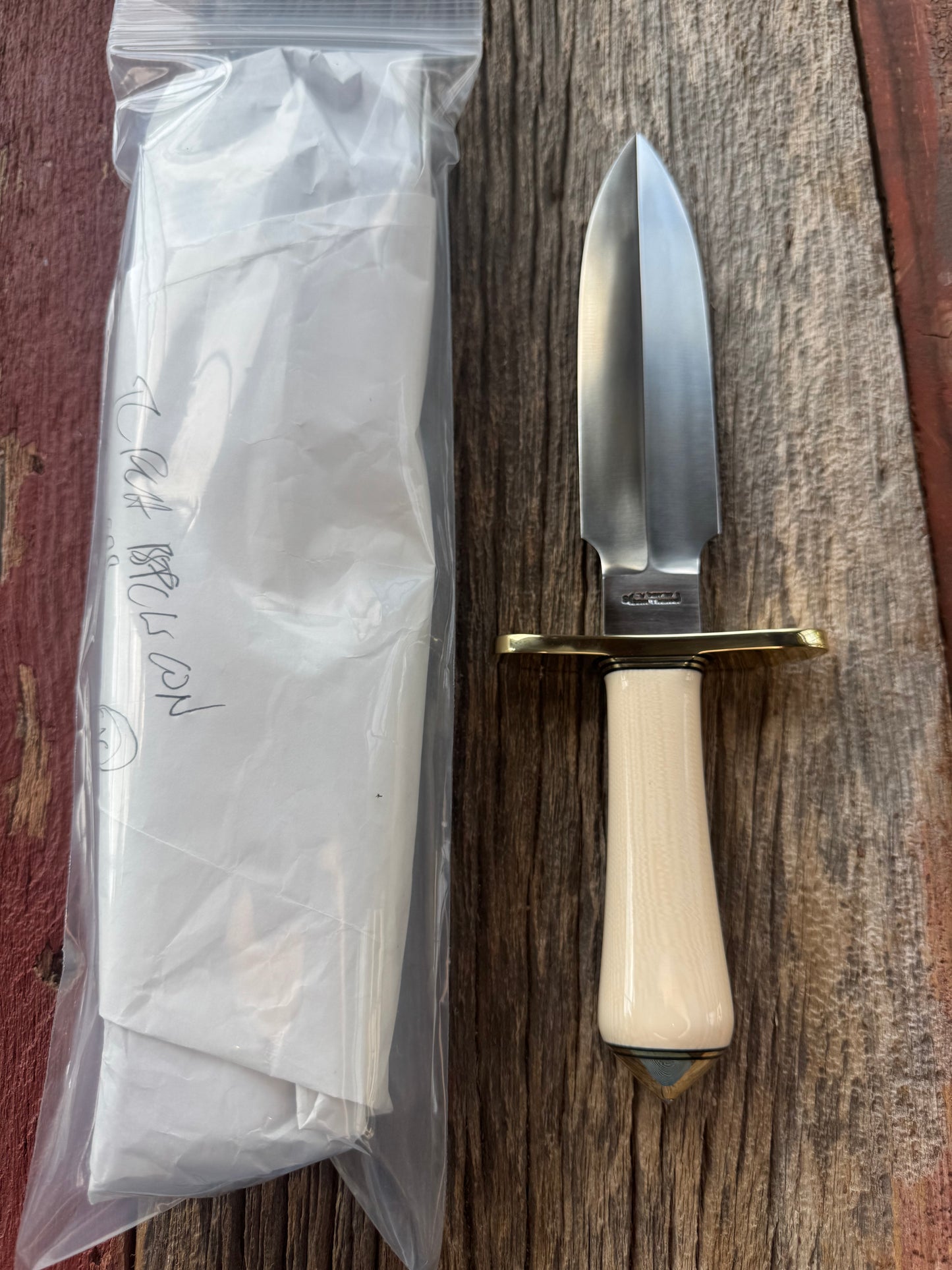 New in paper Randall Clinton Special with a nice piece of customer supplied Warthers Resin with concave grip, Stainless Steel, Brass Hilt and brass coolie cap.