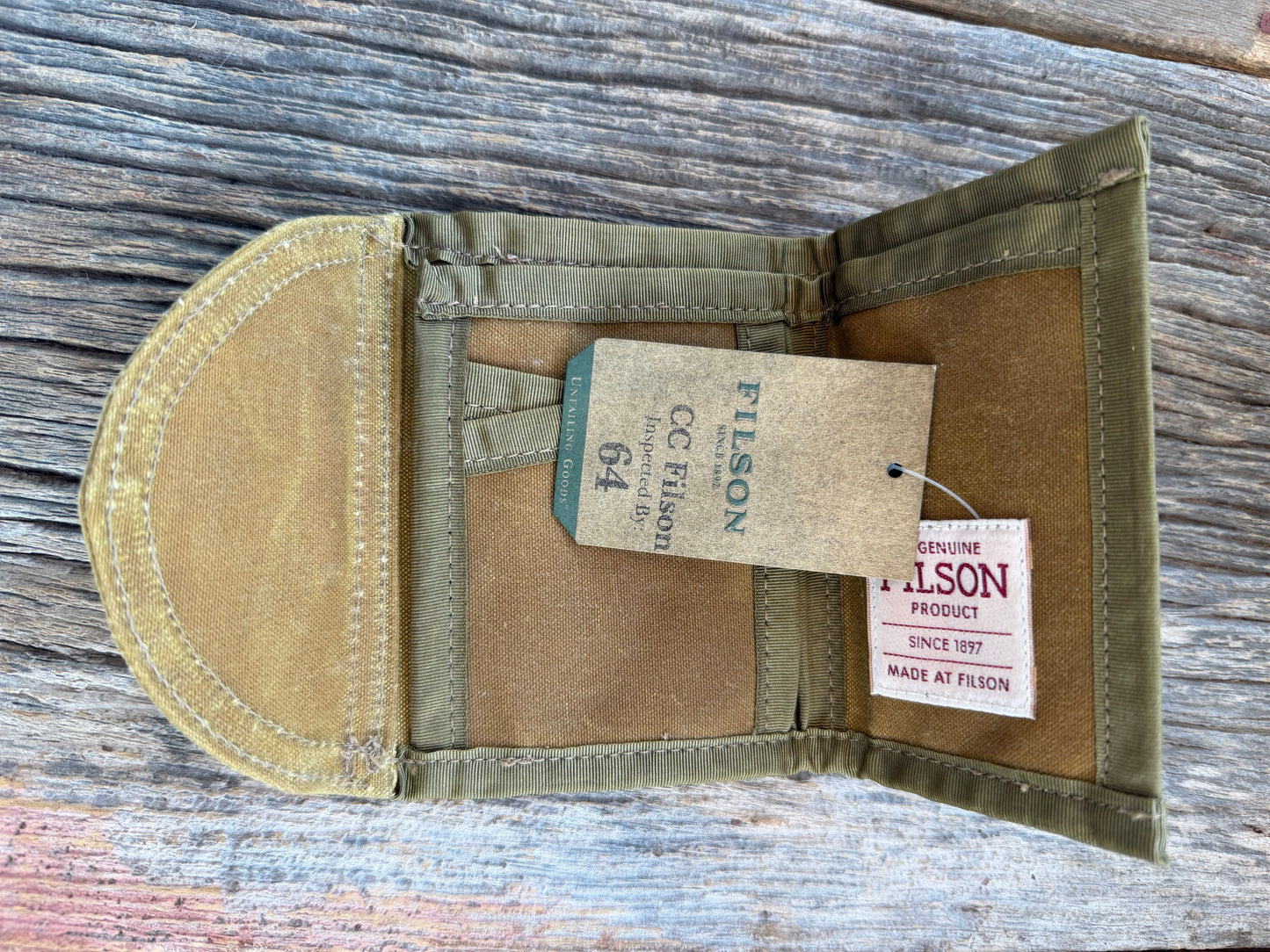 Adding to cart will not result in a sale. Personal Collection..Rare New with Tags Filson Oil Tin Cloth Tri Fold Wallet in Dark Tan # 11069150 from February 2016.