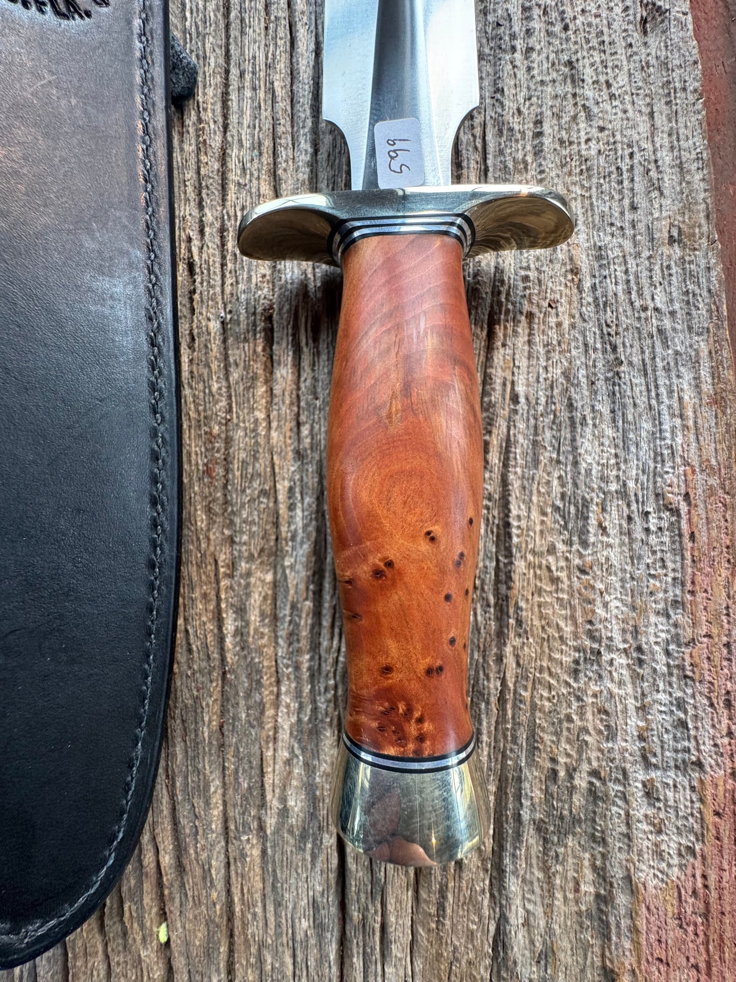 Like new Randall Model 2-8 Stainless steel blade, Nickel silver hilt and butt cap. Black leather sheath. Thuya wood handle.
