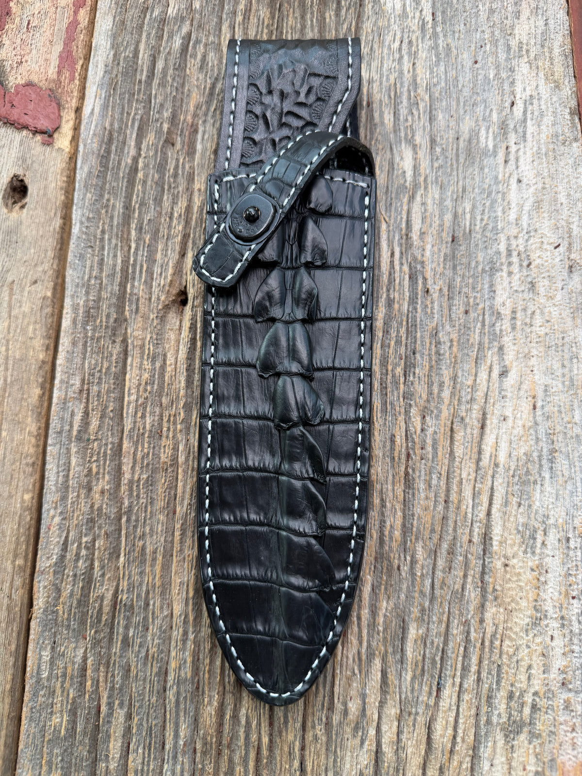 New Randall Model Clinton Special Sheath in Exotic Black Matte Crocodile tail from Treeman with a Black Canteen snap. White thread deviated stitching on black leather..Killer sheath.
