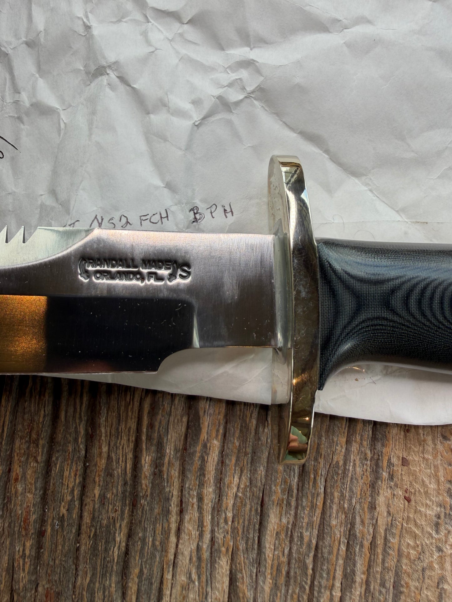 New in Paper Randall Model 14-7.5 in Black Micarta handle, Nickel Silver Hilt, Stainless steel, Sawteeth and Lanyard.