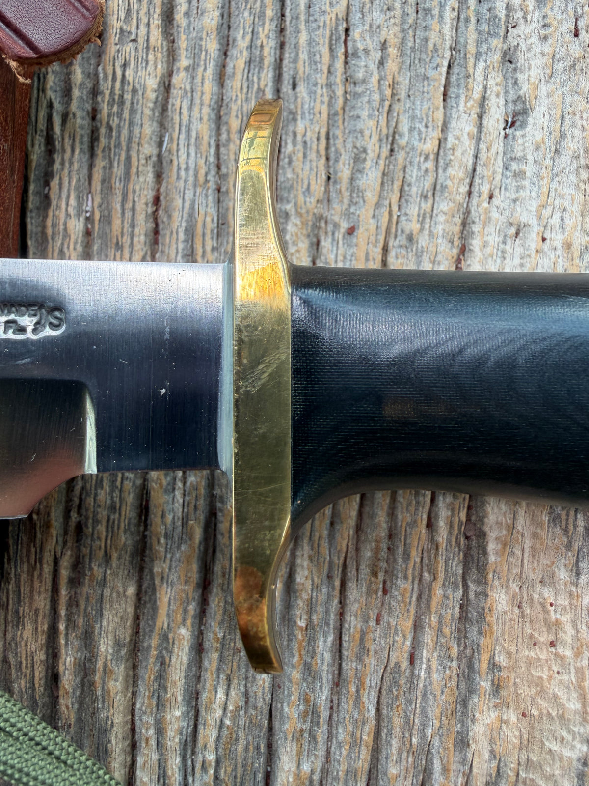 Nice Randall Model Combat Companion in Black Micarta. SS blade, brass hilt. Lanyard and paracord, Brown leather sheath.