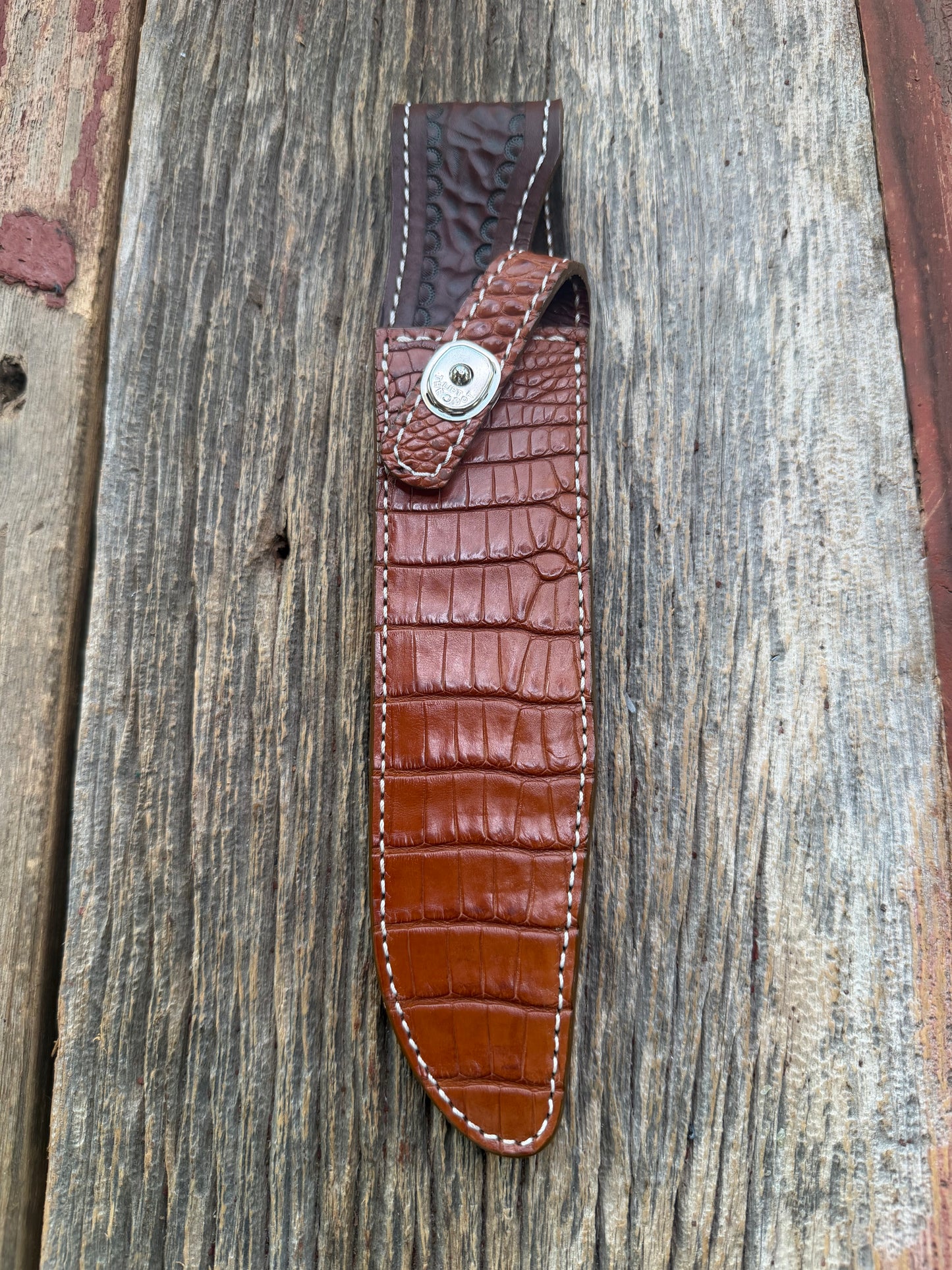 New Randall Model 1-8 Sheath in Exotic thick and textured Honey Crocodile skin on brown leather from Treeman with a silver Canteen snap. Hand tooled belt loop. Killer sheath.