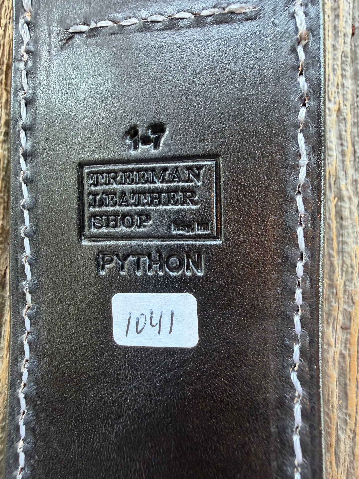 New Randall Model 1-7 Sheath in Exotic Brown Python Snake skin on black leather from Treeman with a black Canteen snap. Hand tooled belt loop. Deviated white stitching. Killer sheath.