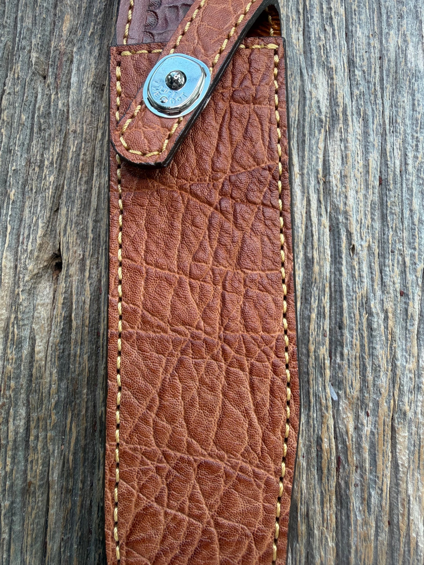 New Randall Model 1-8 Sheath in Exotic thick and textured Rust colored Elephant hide on brown leather from Treeman with a silver Canteen snap. Hand tooled belt loop. Killer sheath.