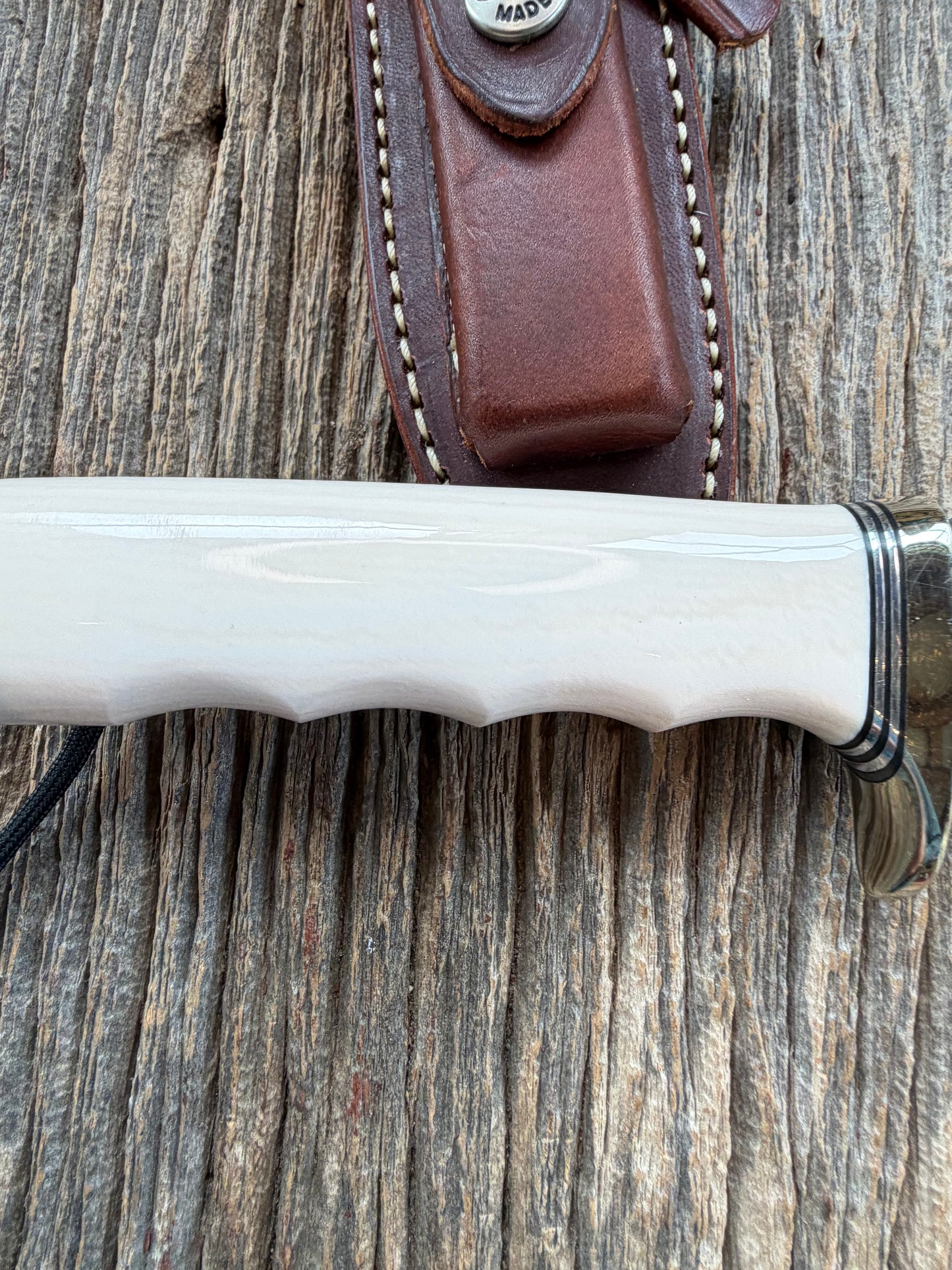 Randall Model Combat Companion with a nice piece of customer supplied Warthers Resin with finger grooves. Teeth, Nickel Silver Hilt and a raw natural end.