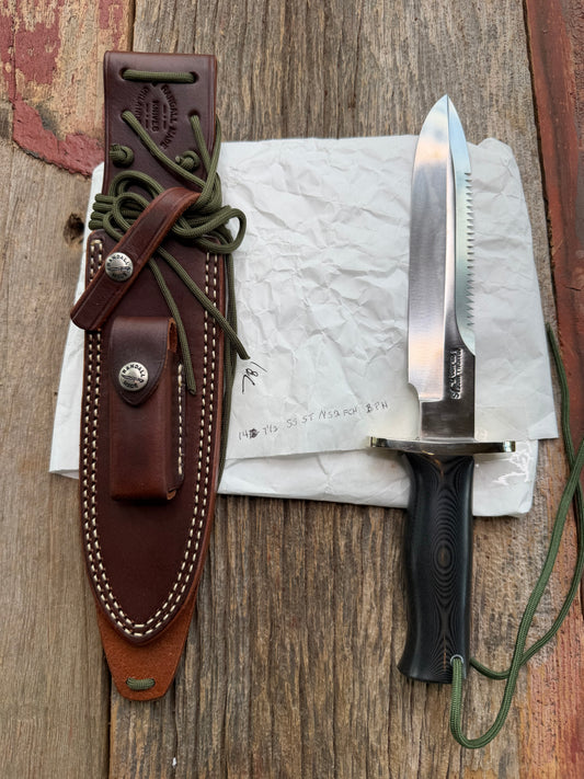 New in Paper Randall Model 14-7.5 in Black Micarta handle, Nickel Silver Hilt, Stainless steel, Sawteeth and Lanyard.
