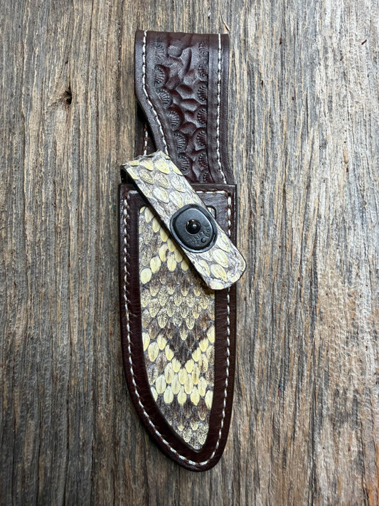Randall Model 23 sheath with an Eastern Diamondback RattleSnake skin from Treeman Sheaths. Hand tooled belt loop, canteen snap. One the hardest skins to source.