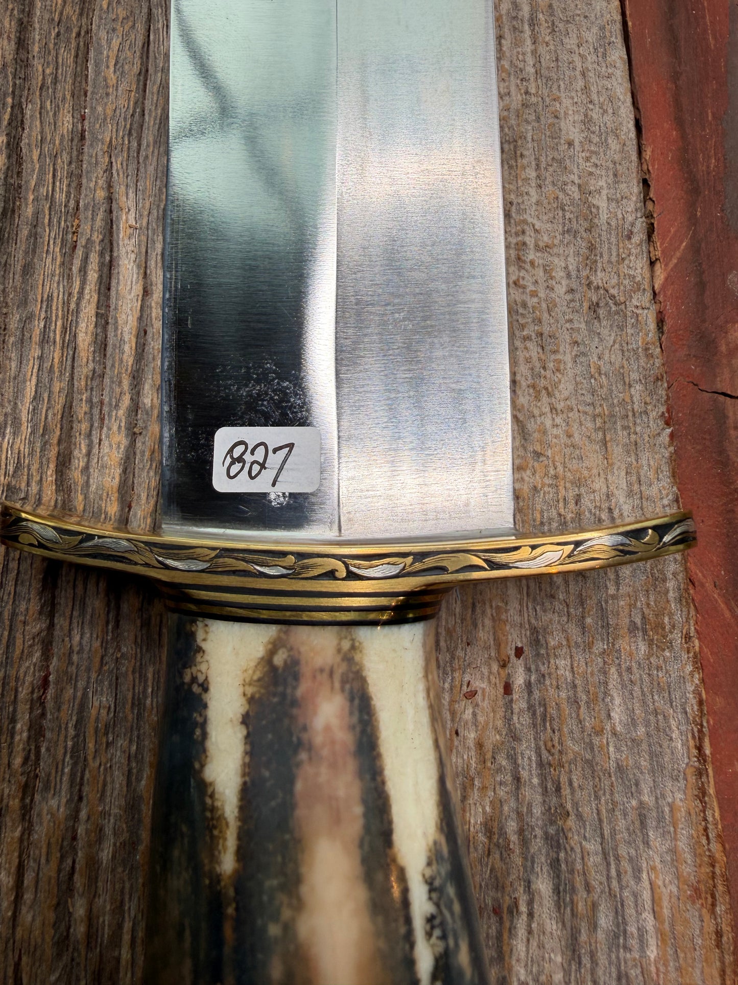 Randall Model 12-11 Smithsonian “Smitty” in a Huge piece of Green, Brown and Blue Fossil Walrus Ivory. Brass Hilt and Brass Butt plate fully engraved in Silver from Jere Davidson.  Stunning piece.