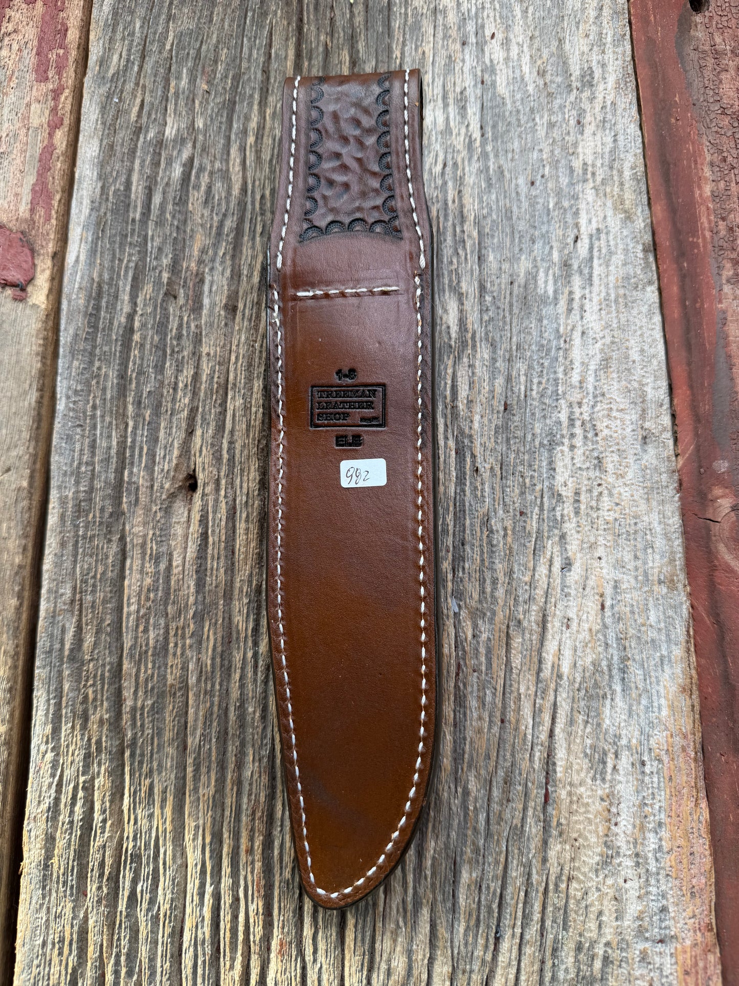 New Randall Model 1-8 Sheath in Exotic thick and textured Black and Grey Elephant Ear  on brown leather from Treeman with a silver Canteen snap. Hand tooled belt loop. Killer sheath.