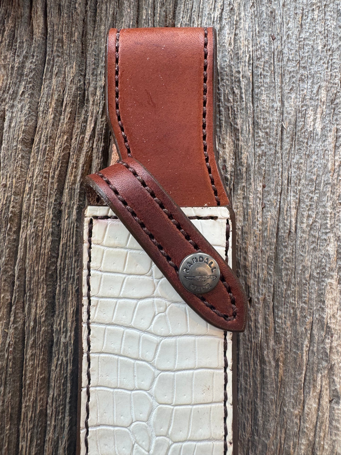 New Randall Model 1-8 or 2-8 Sheath in Exotic white Natural Croc with Anus and full leather belt loop. Custom Made at Sullivan’s by Gutcher with Randall stamp on back and snap.
