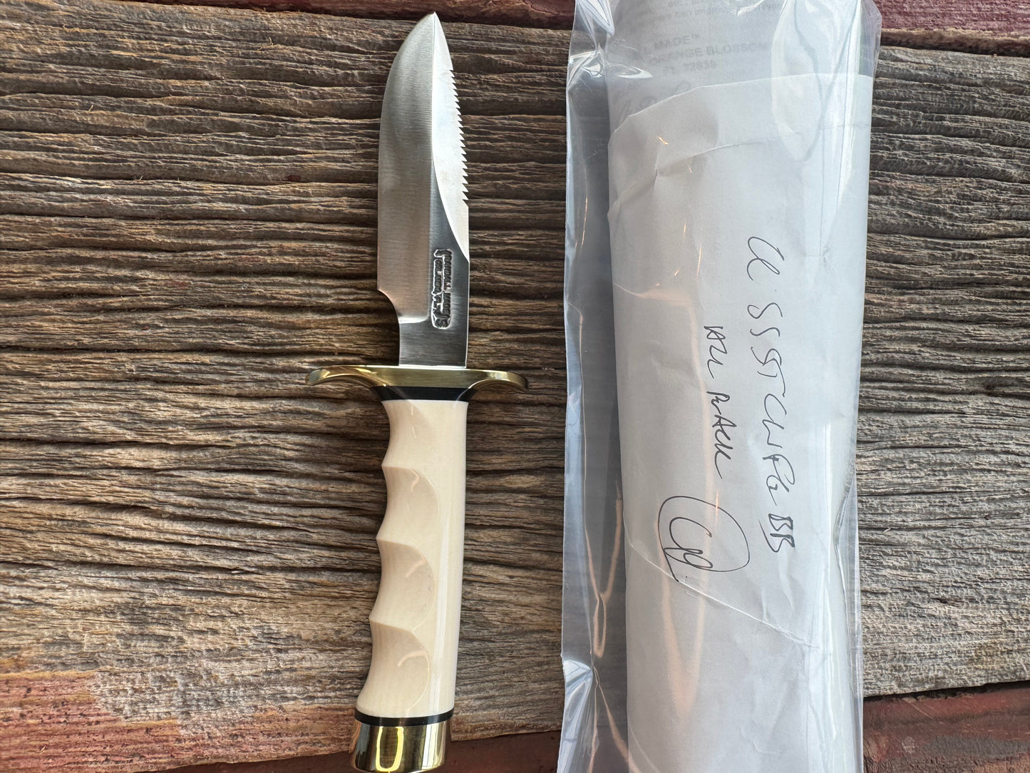 New in paper Randall Model Combat Companion with a nice piece of customer supplied Warthers Resin with finger grooves. Teeth, Stainless Steel, Brass Hilt and brass butt cap.