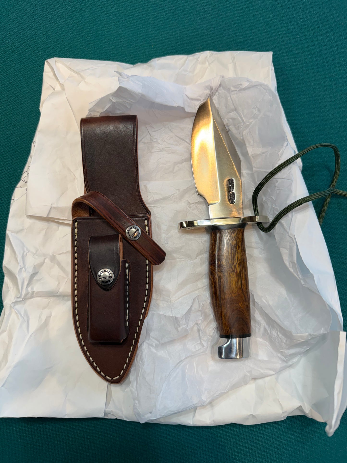 New in Paper Randall Model 19-5 with a nice piece of Ironwood. Nickel silver Hilt and Aluminum crows beak Butt cap.