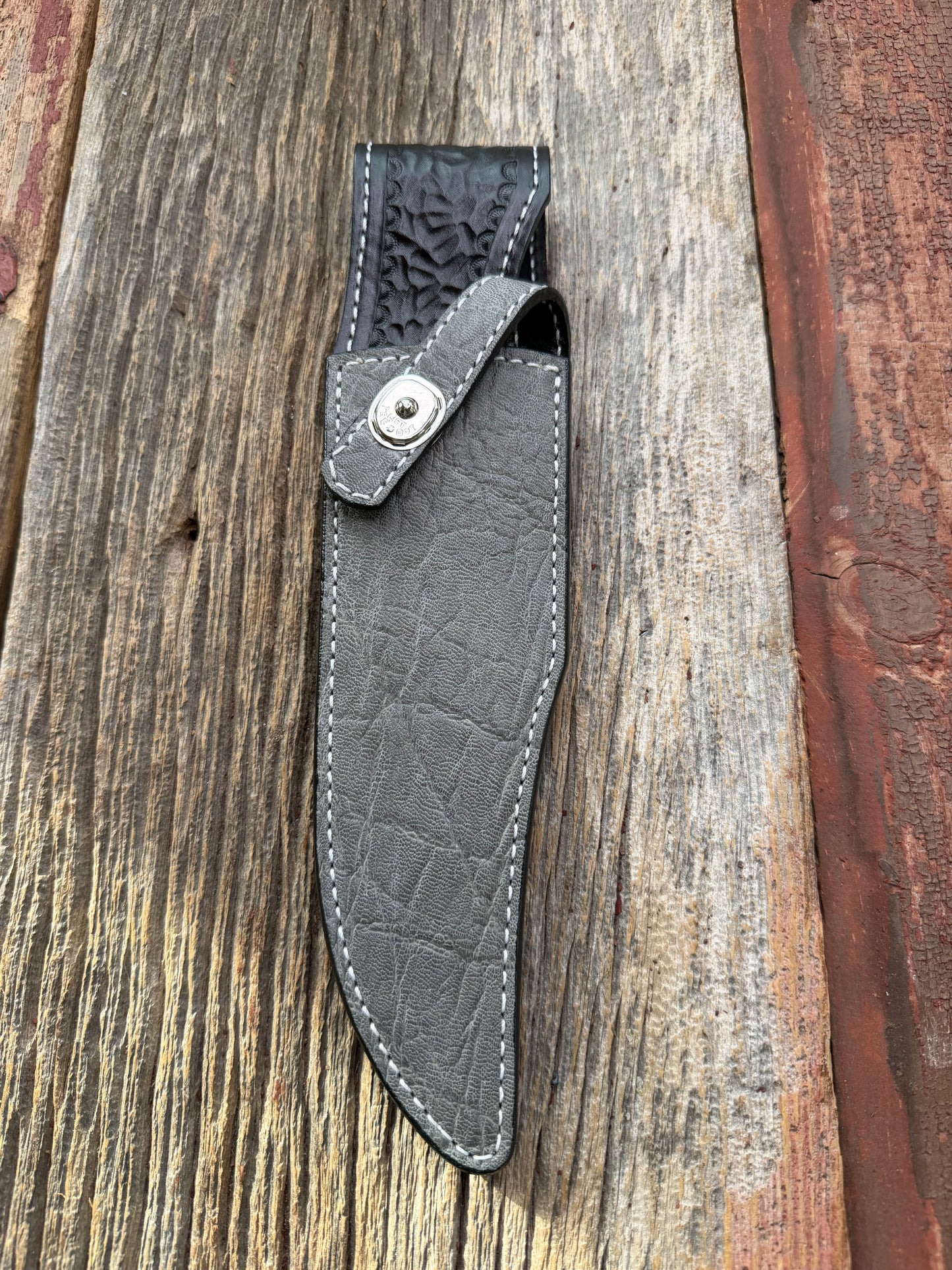 New Randall Model 12-8 Big Bear Sheath in Exotic thick and textured Grey Elephant Hide on black leather from Treeman with a silver Canteen snap. Hand tooled belt loop. Killer sheath.
