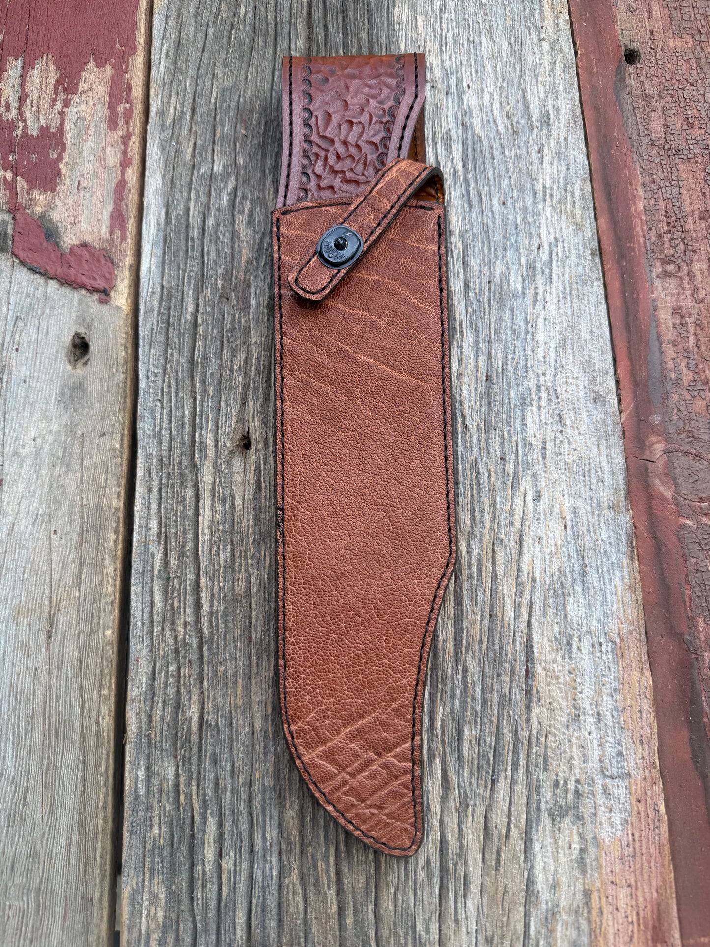New Randall Model 12-11 Smithsonian Sheath in Exotic thick and textured Rust colored Elephant hide on brown leather from Treeman with a black Canteen snap. Hand tooled belt loop. Killer sheath.