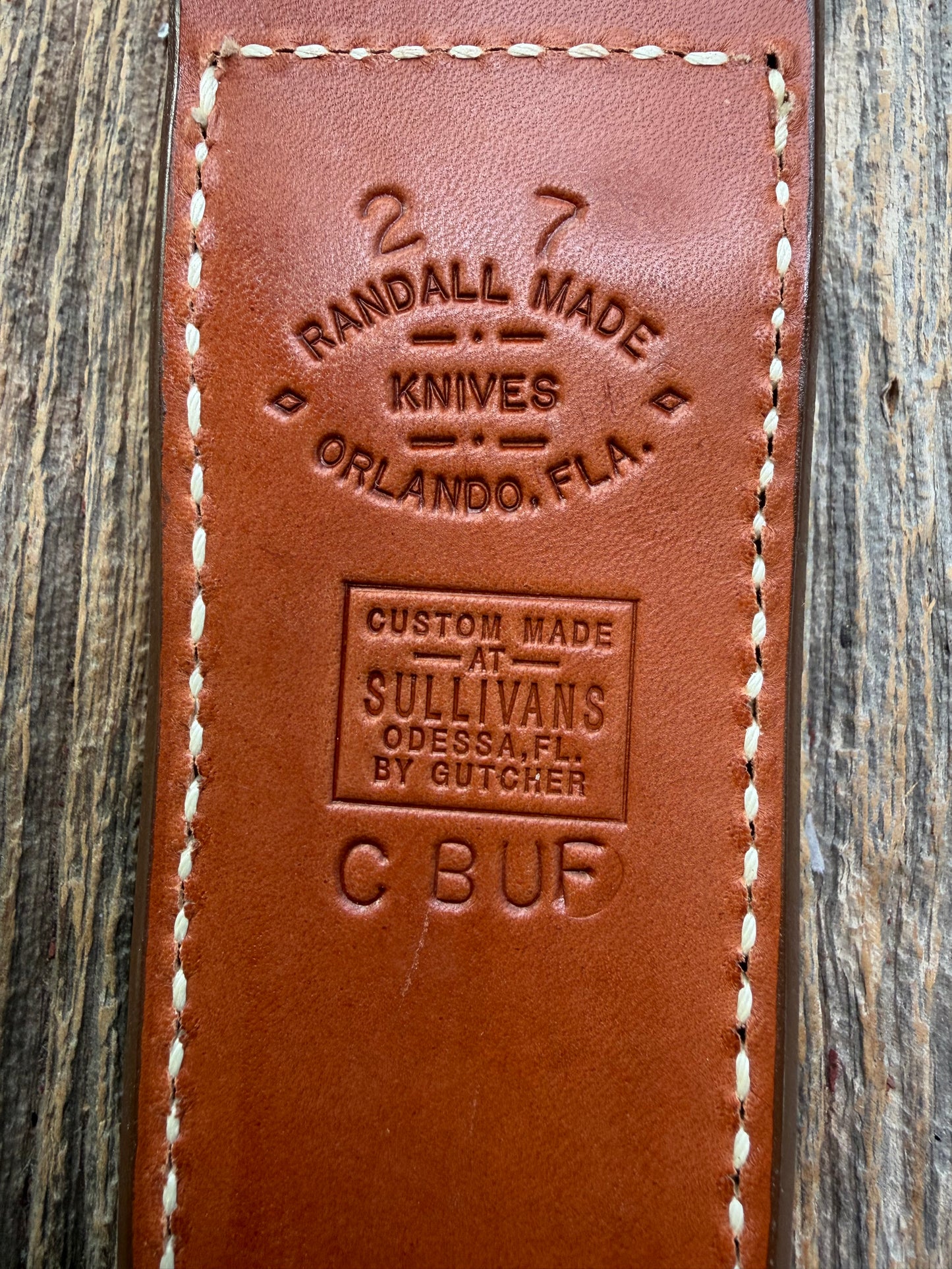 Pristine Randall Model 2-7 sheath in Exotic Cape Buffalo leather from Sullivans by Gutcher. Heavily tooled belt loop and strap. Randall snap and clean stamping on the back … perfect!!
