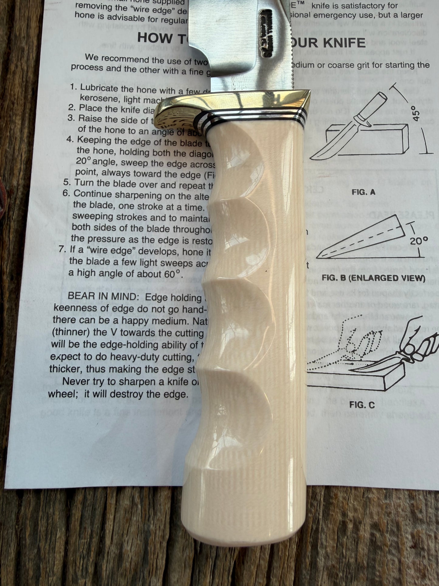 New Randall Model Bowles Skinner # 504 with a Warthers Resin finger grooves handle. Nickel silver Single Hilt and natural end with a compass.