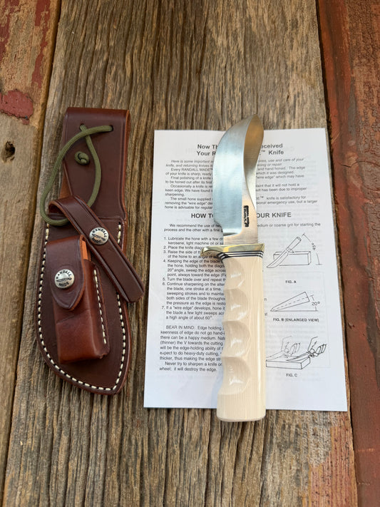 New Randall Model Bowles Skinner # 504 with a Warthers Resin finger grooves handle. Nickel silver Single Hilt and natural end with a compass.