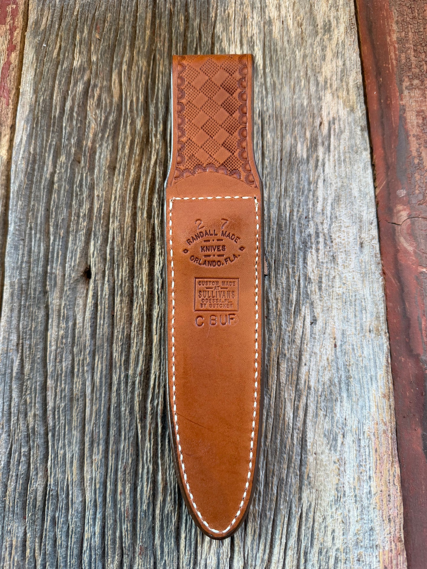 New Randall Model 2-7 Sheath in Exotic Brown Cape Buffalo with full leather hand tooled belt loop. Randall snap and stamp on the back. Custom Made at Sullivan’s by Gutcher