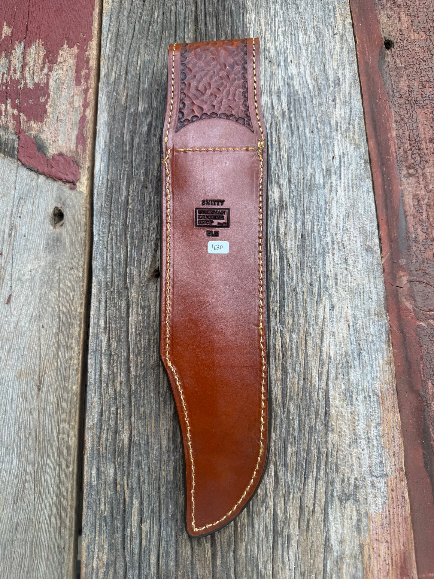 New Randall Model 12-11 Smithsonian Sheath in Exotic thick and textured Rust colored Elephant hide on brown leather from Treeman with a silver Canteen snap. Hand tooled belt loop. Killer sheath.