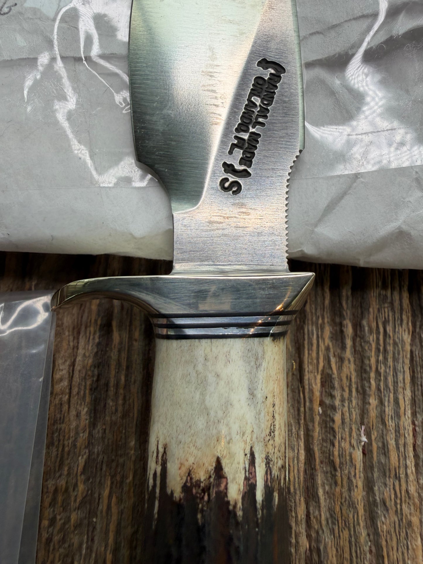 New in Paper Randall Made Knife Model 11-4 with a Stag handle, Stainless, Nickel silver single Hilt, Black and aluminum spacers.