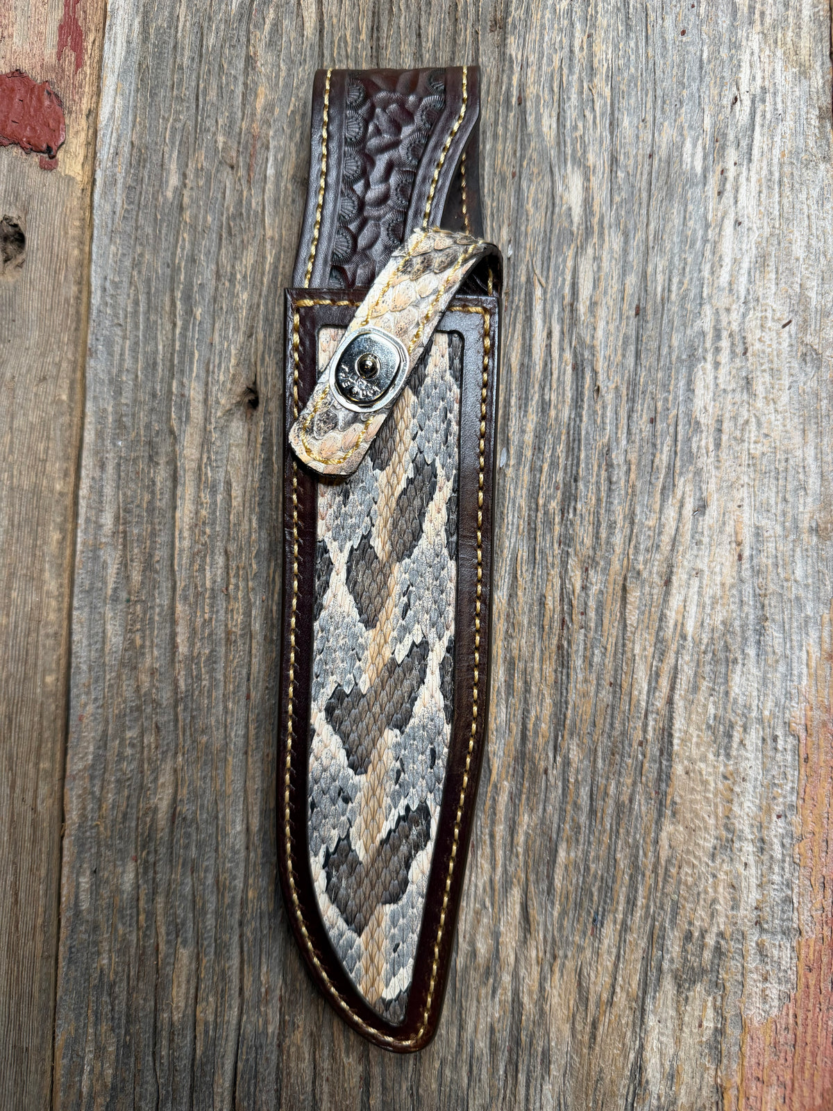 Randall Model 1-8 sheath with a Canebrake RattleSnake skin from Treeman Sheaths. Vibrant colors and along side Copperheads the hardest skin to source.
