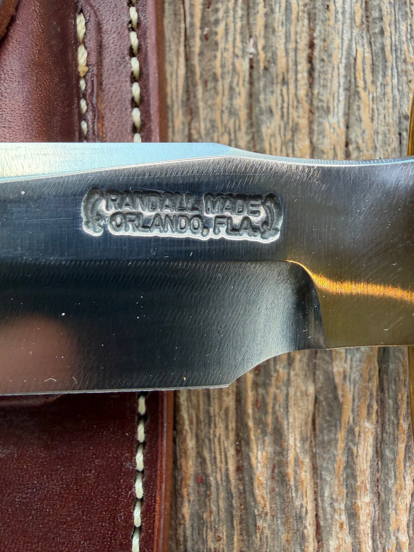New in Paper Randall Model 1-7 Maroon Micarta Brass Hilt, Natural end, single black spacer, carbon steel.