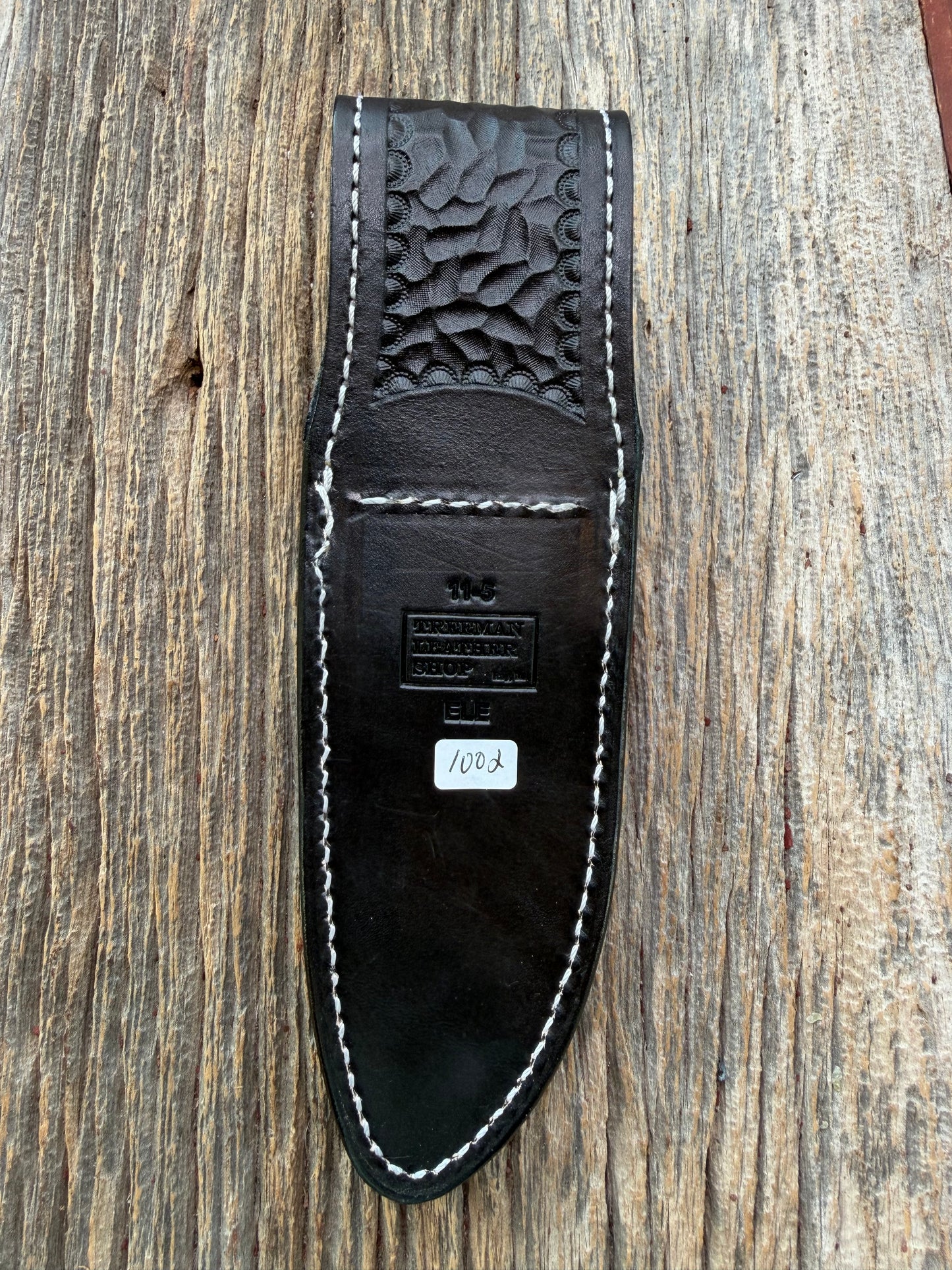 New Randall Model 11-5 Sheath in Exotic thick and textured Black Elephant hide on black leather from Treeman with a black Canteen snap. Hand tooled belt loop. Killer sheath.
