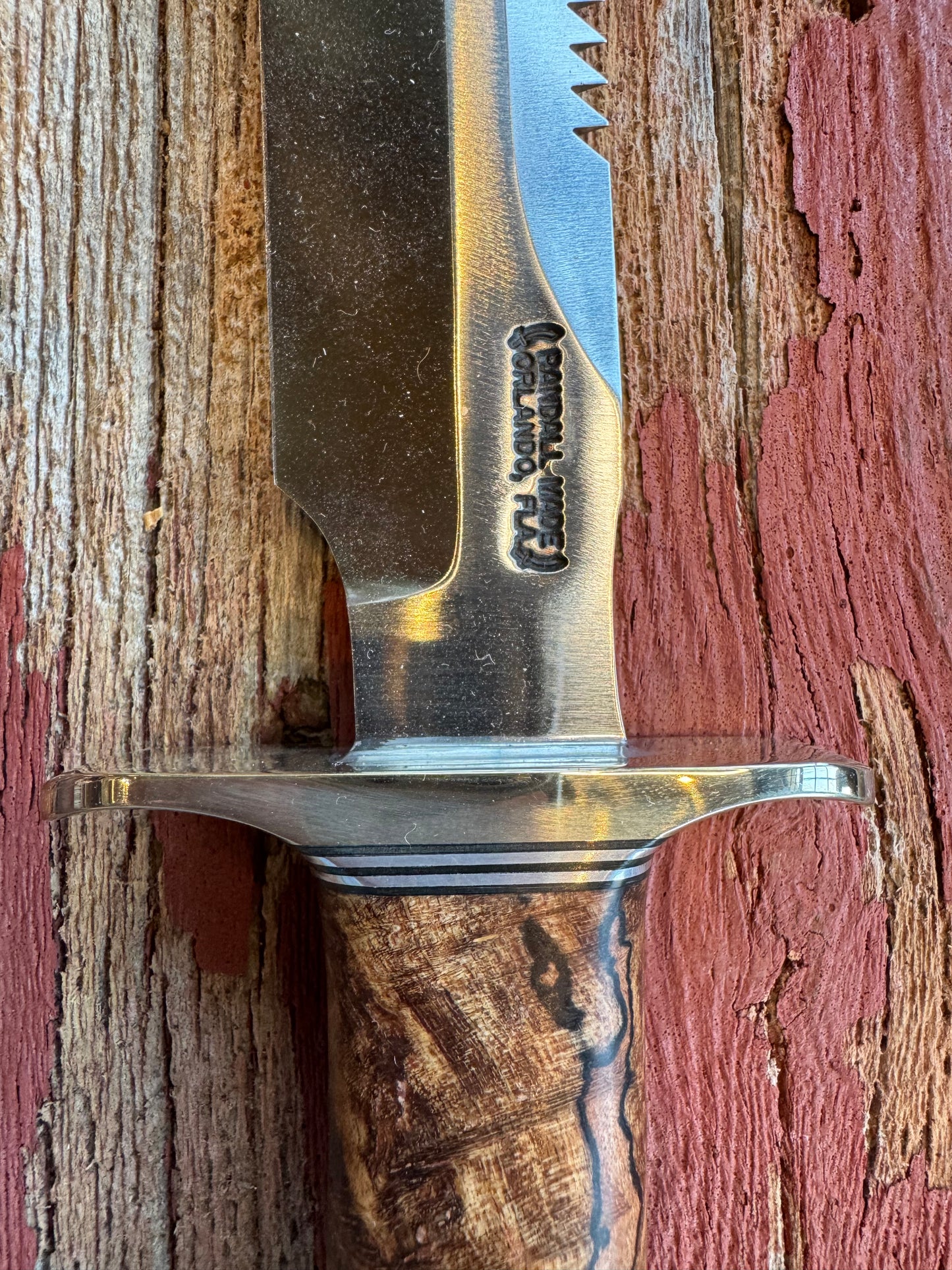 New in paper Randall Knife Model 1-7 Spalted Ebony wood Handle. Carbon Steel Blade, compass and Sawteeth.