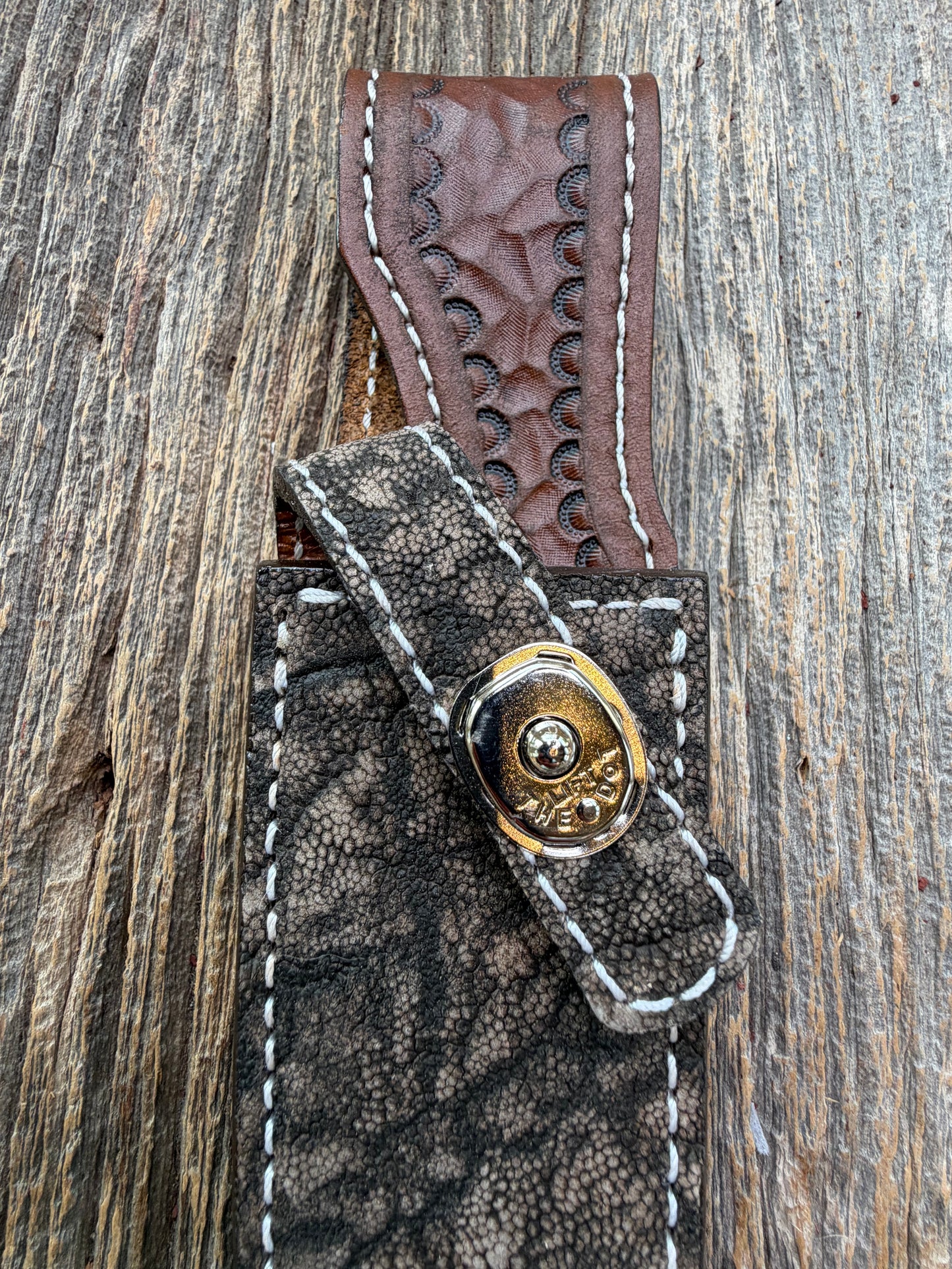 New Randall Model 23 Sheath in Exotic thick and textured Black and Grey Elephant Ear  on brown leather from Treeman with a silver Canteen snap. Hand tooled belt loop. Killer sheath.