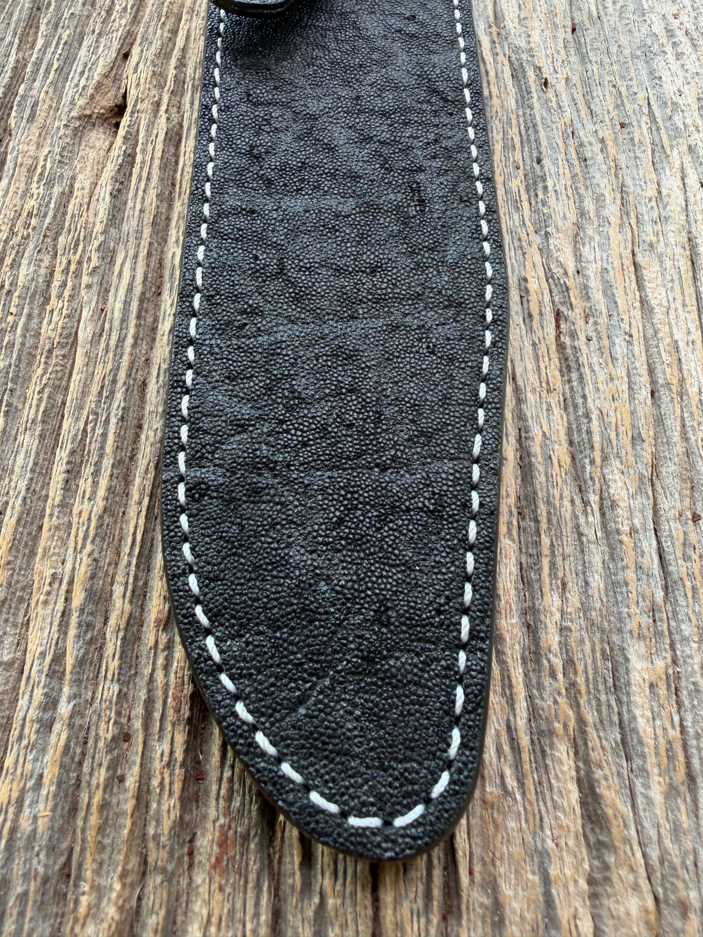 New Randall Model 1-7 Sheath in Exotic thick and textured Black Elephant hide on black leather from Treeman with a black Canteen snap. Hand tooled belt loop. Killer sheath.