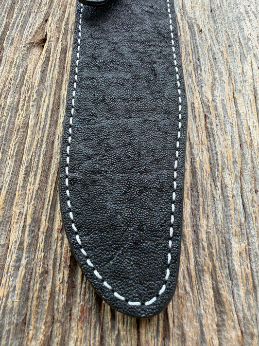 New Randall Model 1-7 Sheath in Exotic thick and textured Black Elephant hide on black leather from Treeman with a black Canteen snap. Hand tooled belt loop. Killer sheath.