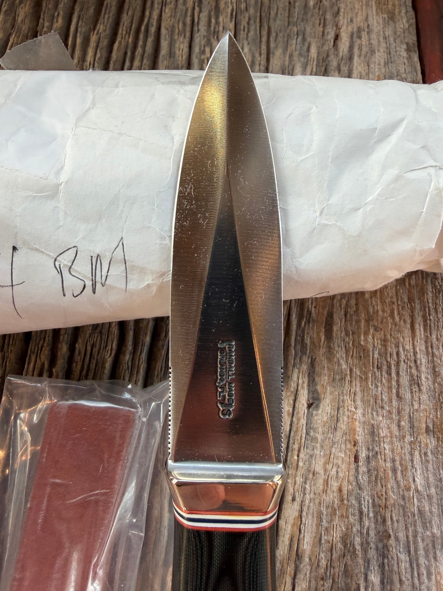 New in Paper Randall Model 24 Guardian in Black Micarta Nickel hilt, Stainless, red white blue spacers.