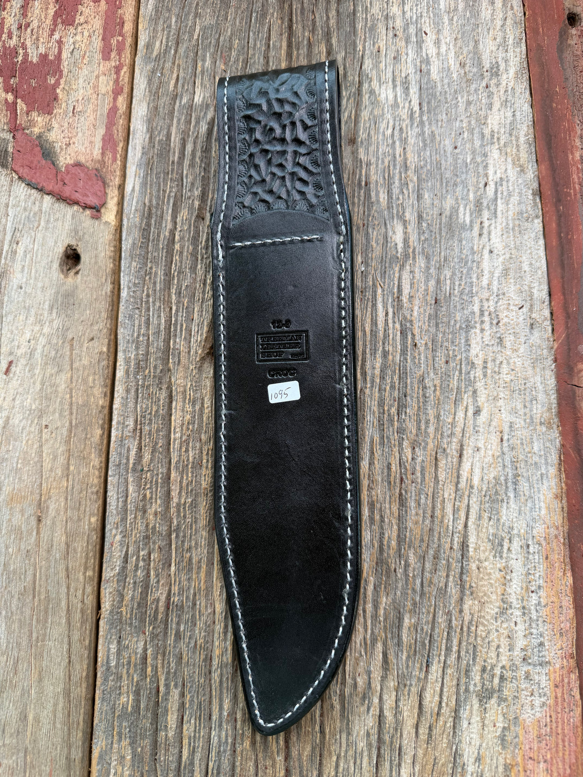 New Randall Model 12-9 Sheath in Exotic Black Matte Crocodile from Treeman with a Black Canteen snap. White thread deviated stitching on black leather..Killer sheath.