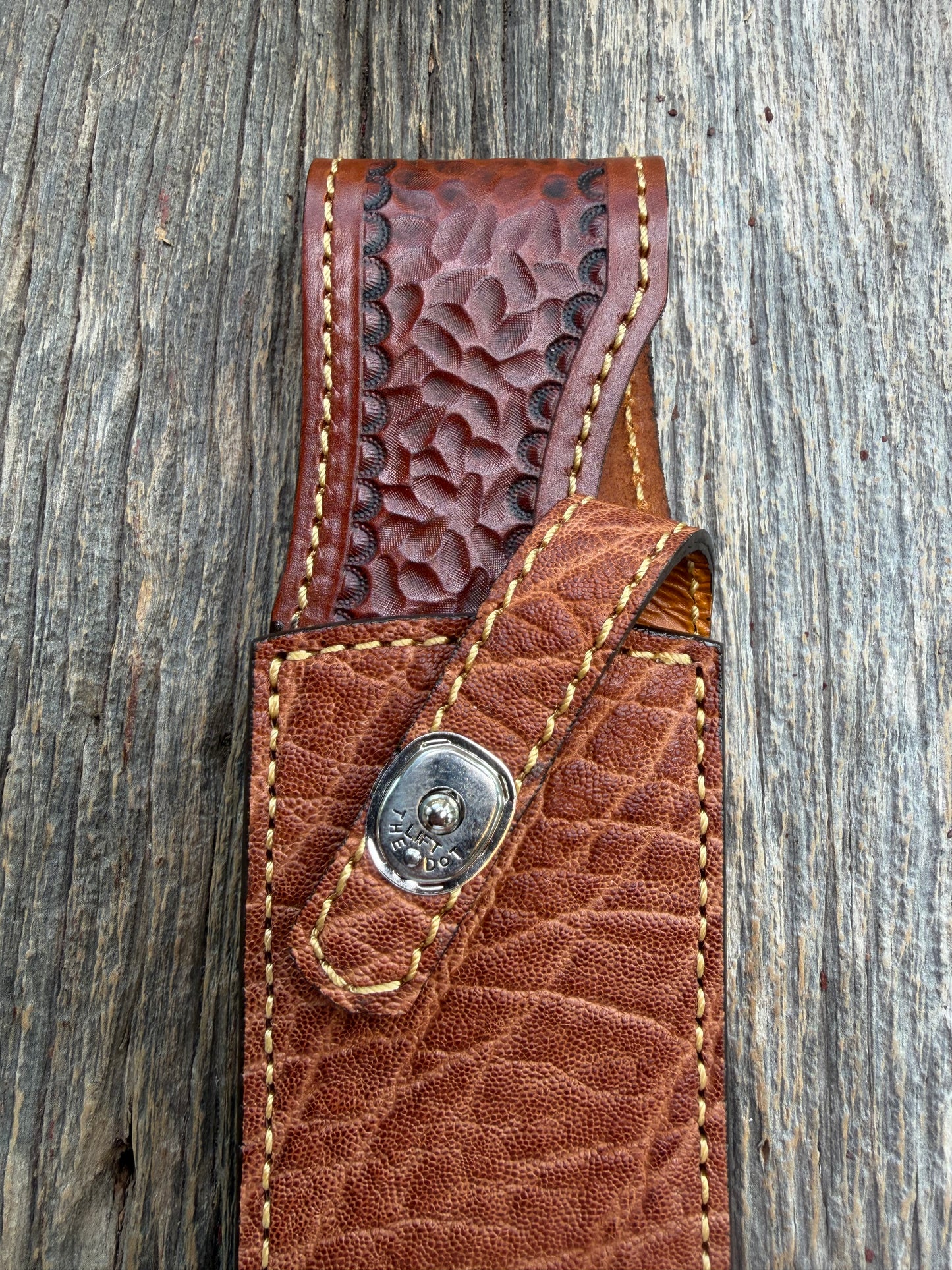 New Randall Model 12-9/14 Sheath in Exotic thick and textured Rust colored Elephant hide on brown leather from Treeman with a silver Canteen snap. Hand tooled belt loop. Killer sheath.