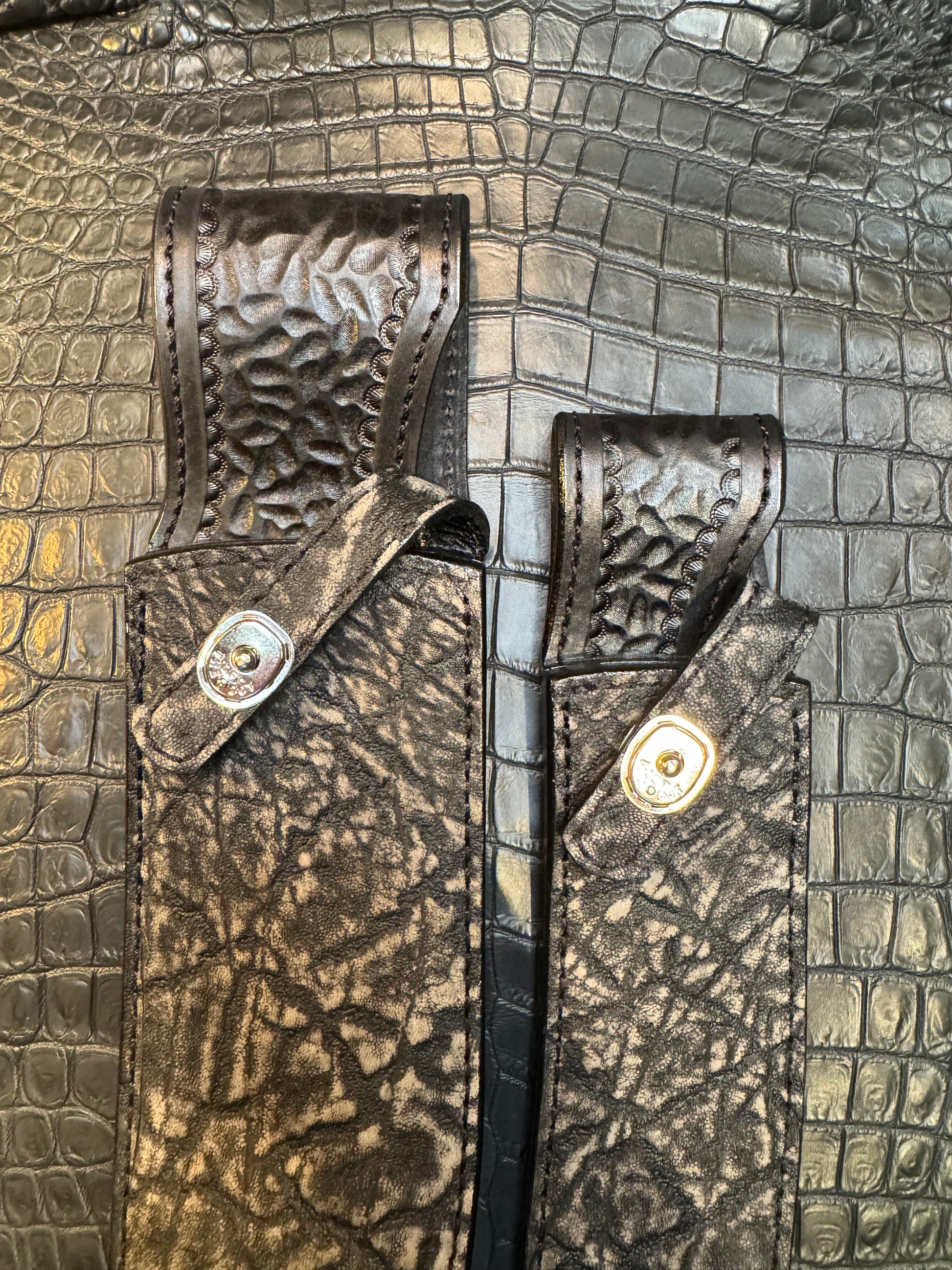 A pair of Randall Model 12-11 Large Sasquatch and Randall Model 12-8 Small Sasquatch Sheaths in Exotic Black Elephant by Treeman.