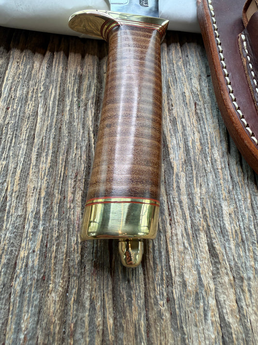 New in Paper Randall Model 19-5 Bushmaster with a Leather handle. Carbon blade, Brass single hilt. Brown leather sheath.