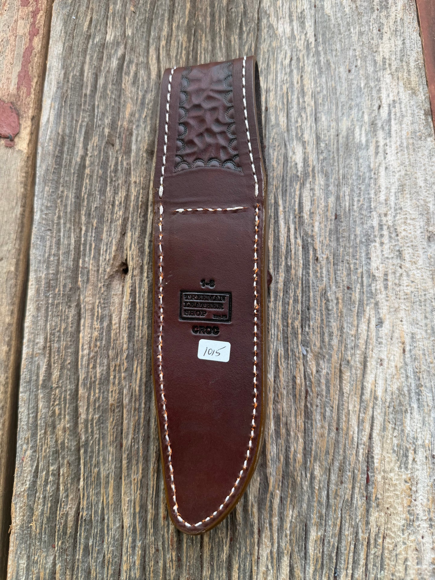 New Randall Model 1-6 Sheath in Exotic thick and textured Honey Crocodile skin on brown leather from Treeman with a silver Canteen snap. Hand tooled belt loop. Killer sheath.