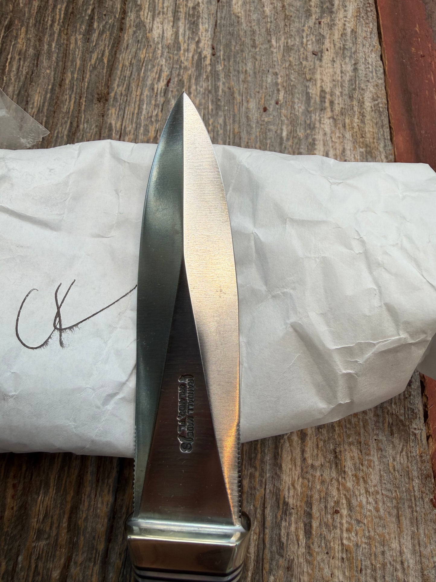 New in Paper Randall Model 24 Guardian in Black Micarta Nickel hilt, Stainless, black and aluminum spacers.
