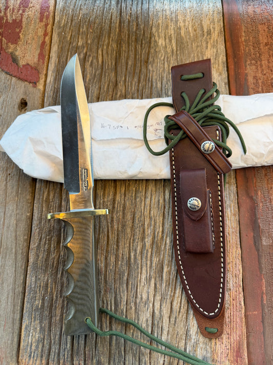 New in Paper Randall Model 16 SP#1 Special fighter with a Green Micarta handle. SS blade, Nickel silver hilt. Lanyard. Brown leather sheath.