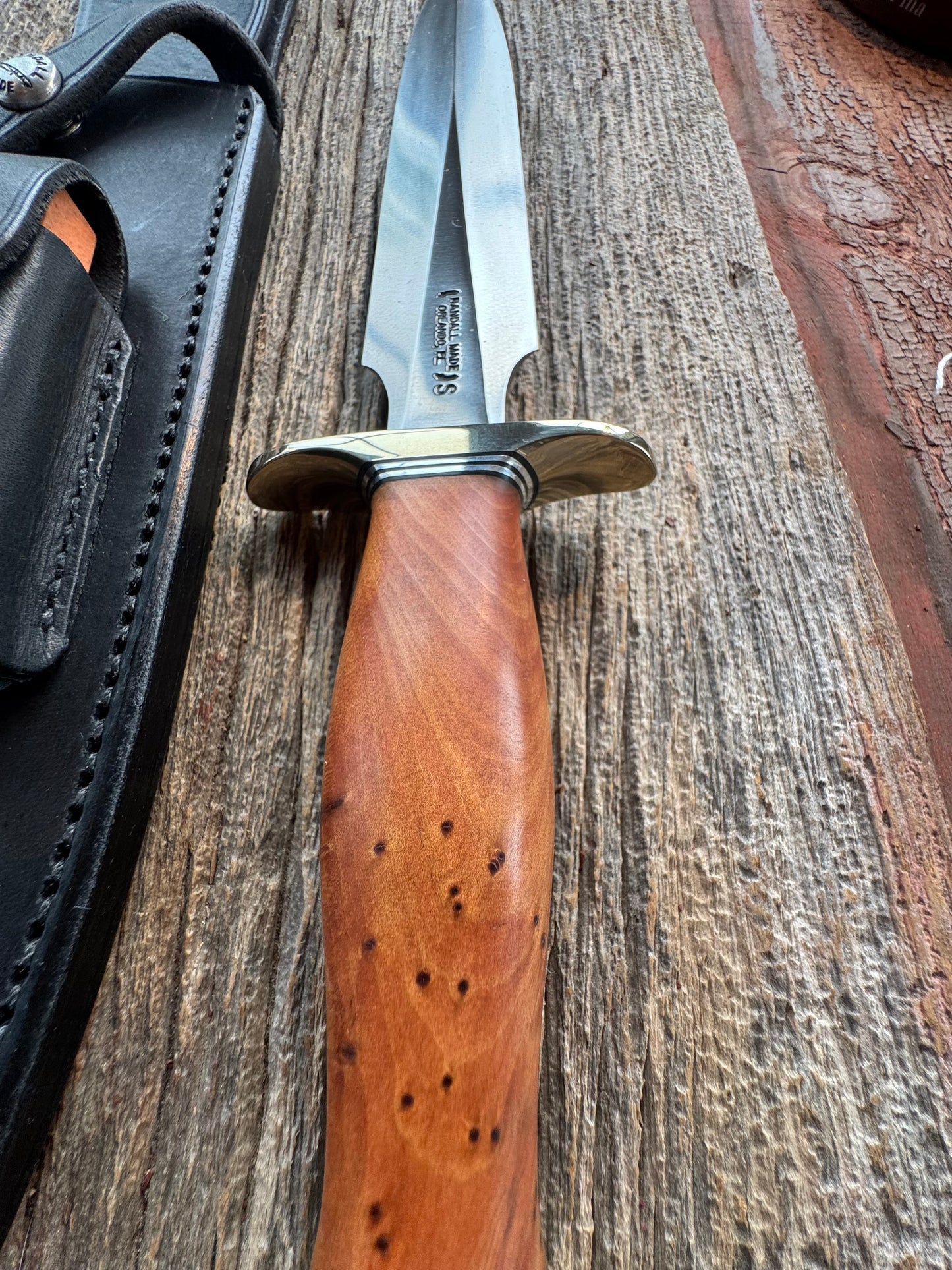 Like new Randall Model 2-8 Stainless steel blade, Nickel silver hilt and butt cap. Black leather sheath. Thuya wood handle.