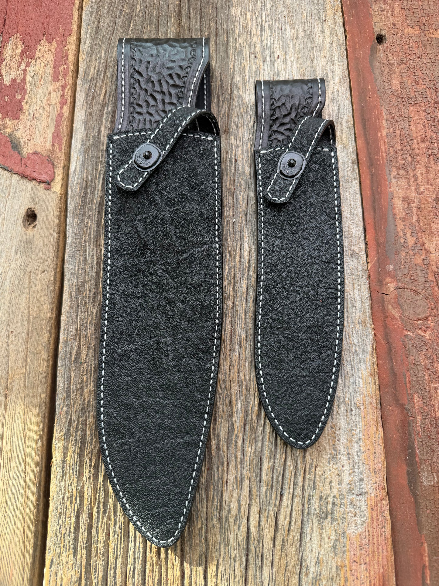 New Randall Model 12-11 Large Sasquatch and 12-8 Small Sasquatch Sheaths in Exotic thick and textured Black Elephant hide on black leather from Treeman with a black Canteen snap. Hand tooled belt loop. Killer sheath. Selling as a pair…