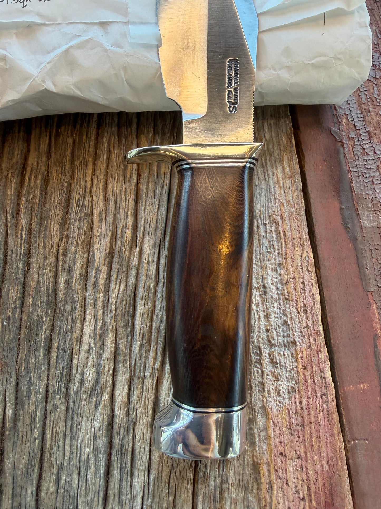 New in Paper Randall Model 19-5 with a nice piece of Ironwood. Nickel silver Hilt and Aluminum crows beak Butt cap.