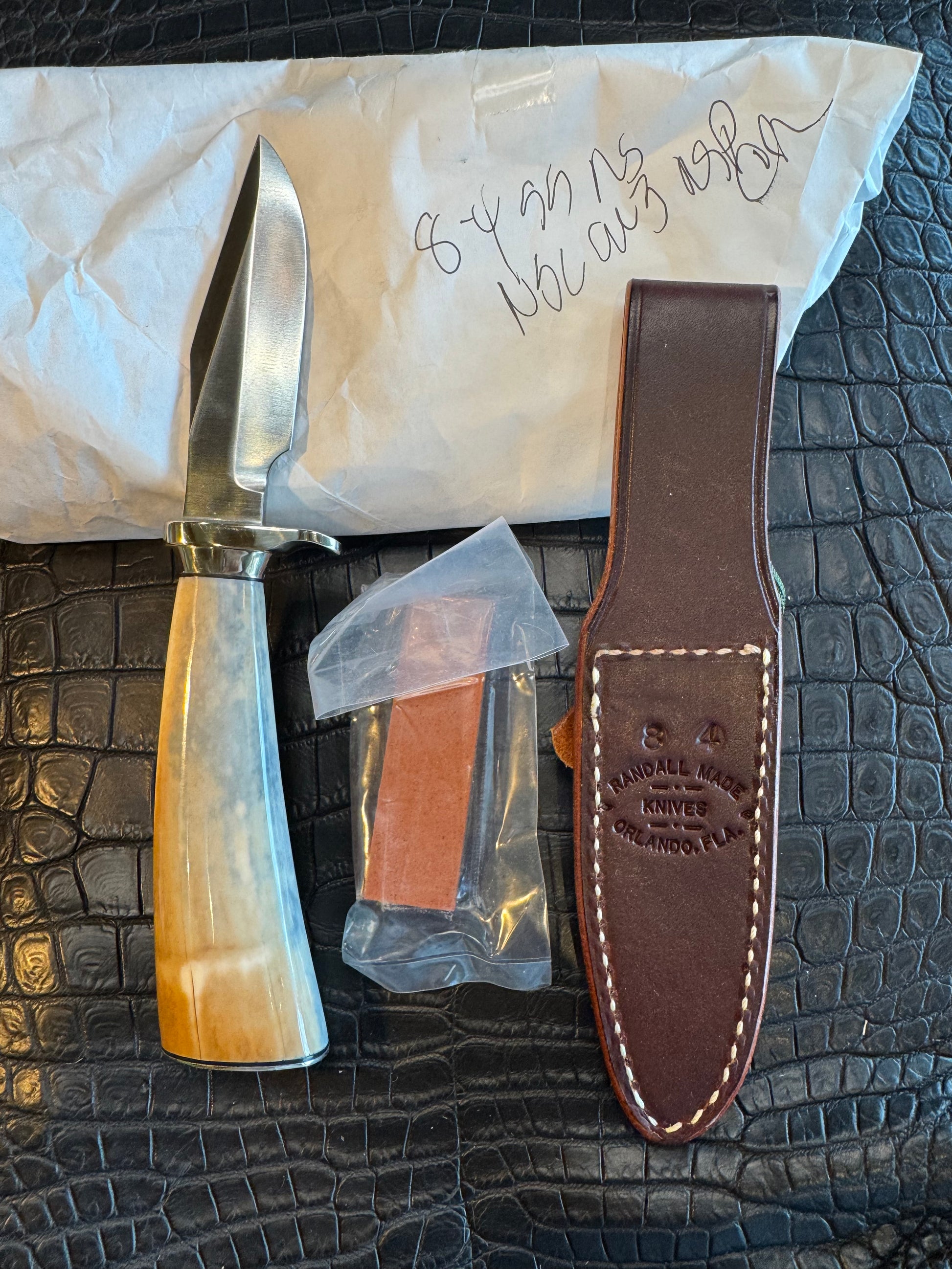 News in Paper Randall Model 8-4 in a gorgeous piece of Cream and Blue Fossil Walrus Ivory. Nickel Silver single hilt with a nickel Collar and butt cap.