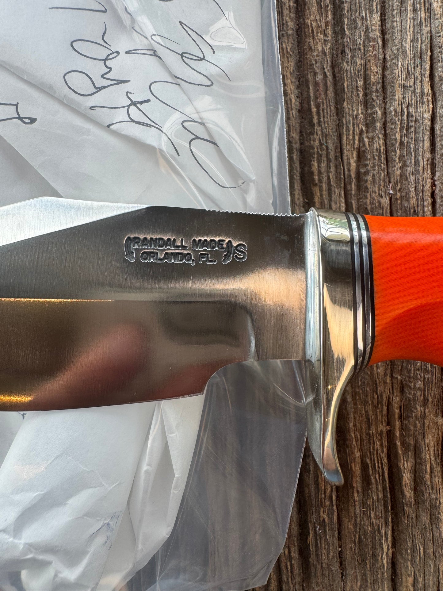 New in paper Randall Model 19-5 with a nice piece of customer supplied Orange G10 with finger grooves. Stainless Steel, Nickel Silver Hilt and a raw natural end.