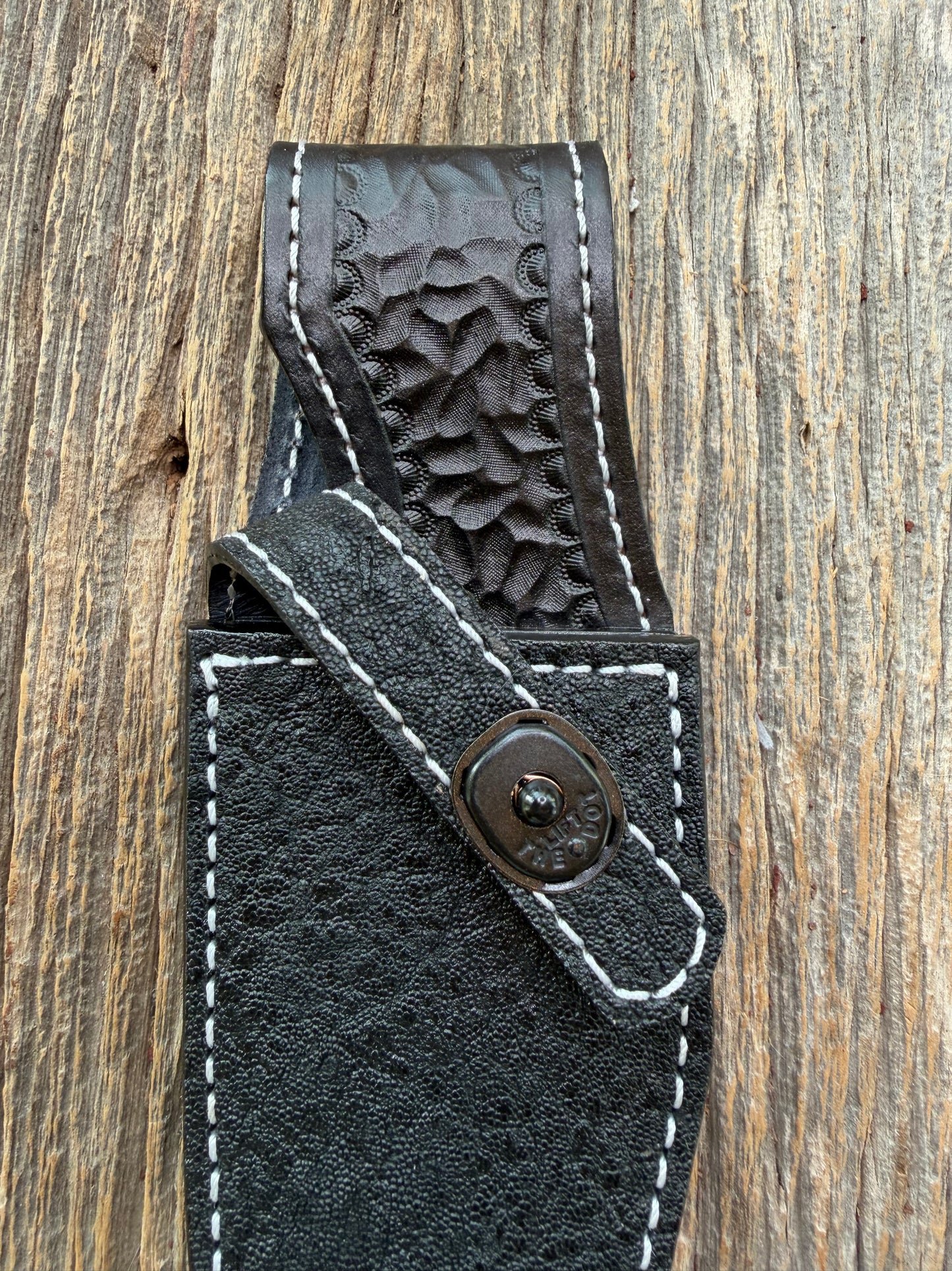New Randall Model 19-5 Sheath in Exotic thick and textured Black Elephant hide on black leather from Treeman with a black Canteen snap. Hand tooled belt loop. Killer sheath.