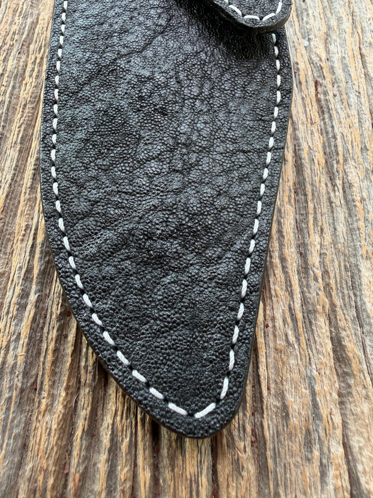 New Randall Model 19-5 Sheath in Exotic thick and textured Black Elephant hide on black leather from Treeman with a black Canteen snap. Hand tooled belt loop. Killer sheath.