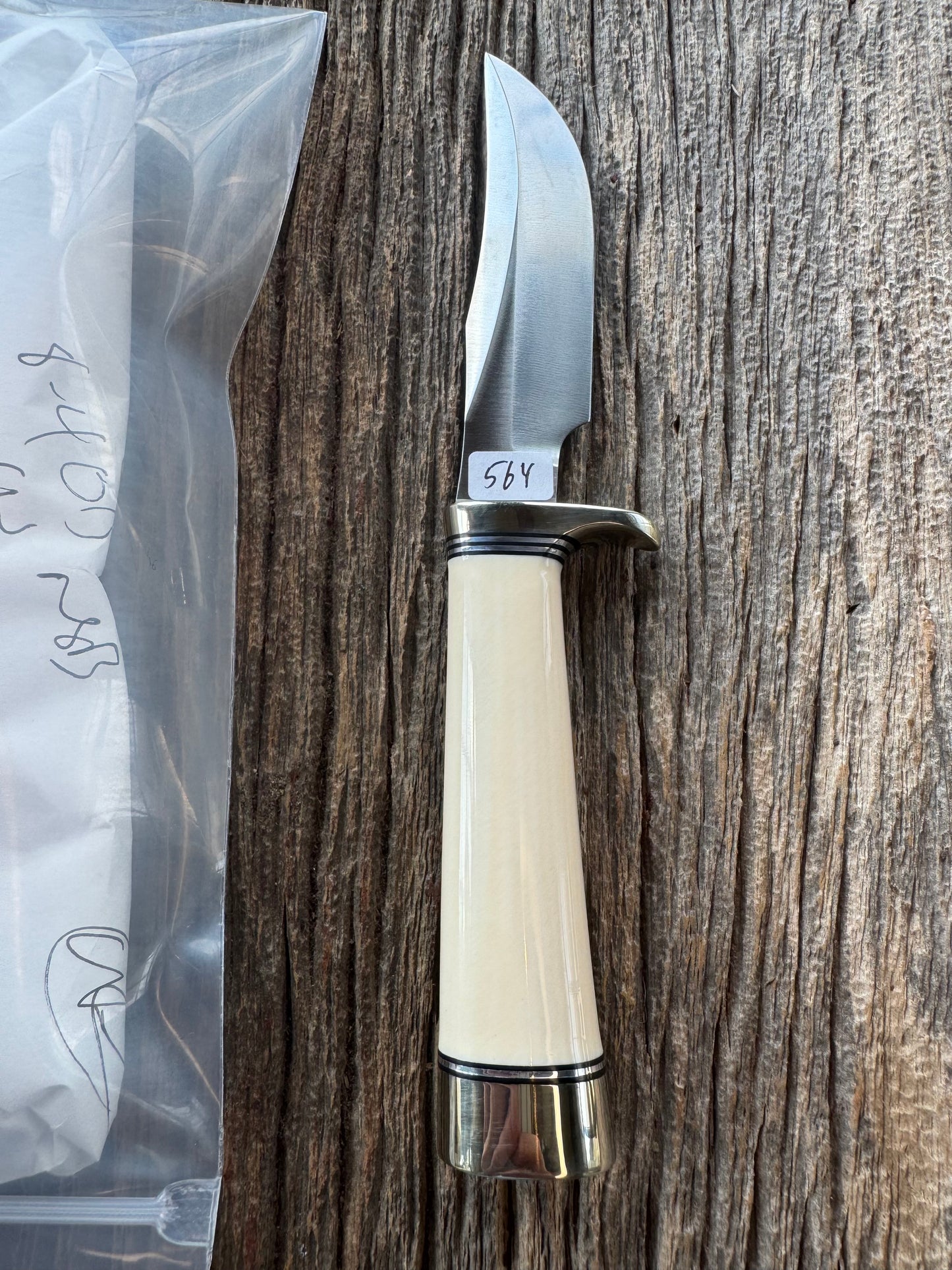 New in paper Randall Model 8-4 with a nice piece of customer supplied Dave Warthers Resin, Stainless Steel, Nickel Silver Single Hilt and butt cap.