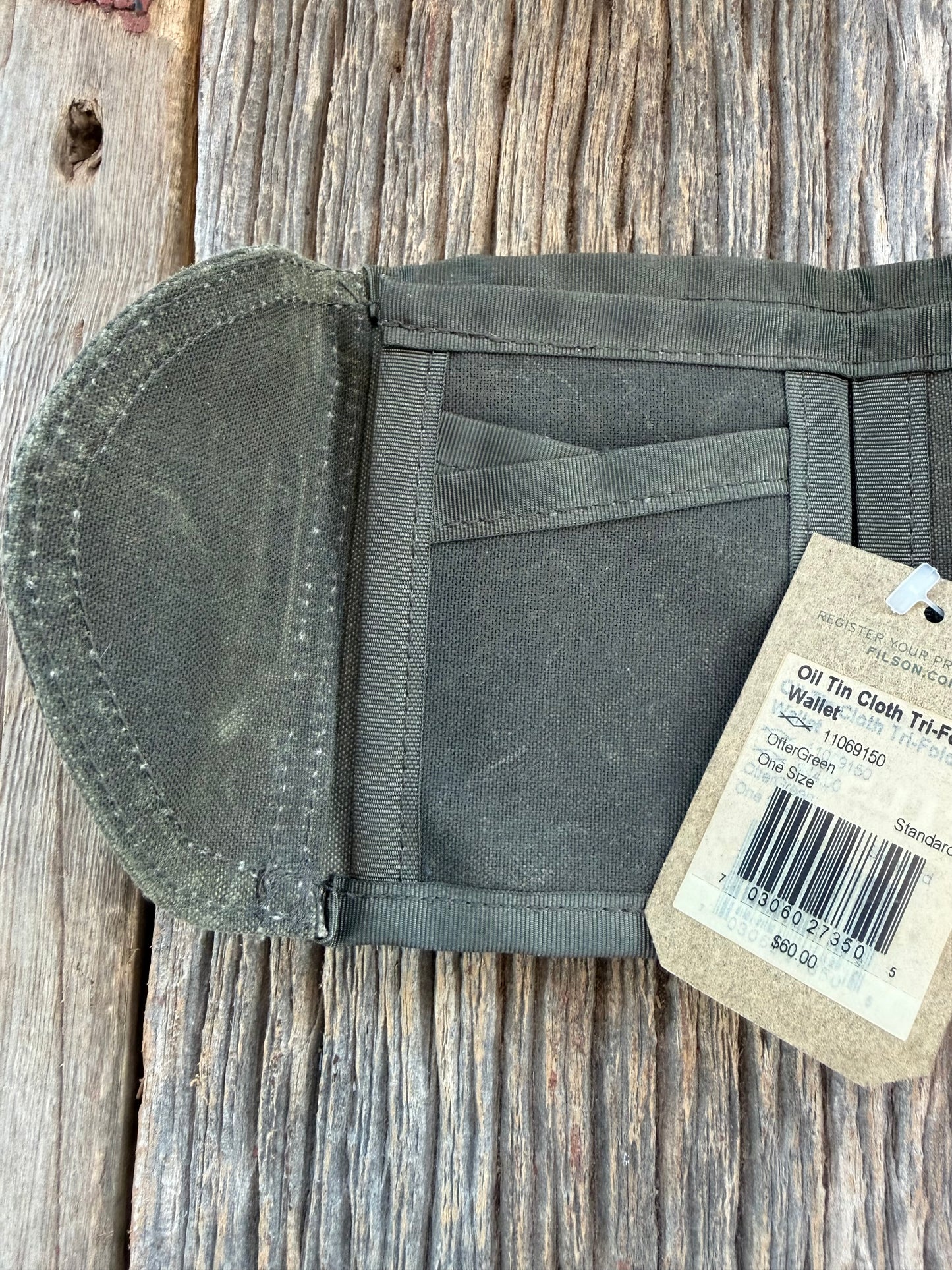 Adding to cart will not result in a sale. Personal Collection..Rare New with Tags Filson Oil Tin Cloth Tri Fold Wallet in Otter Green # 11069150 from February 2016.