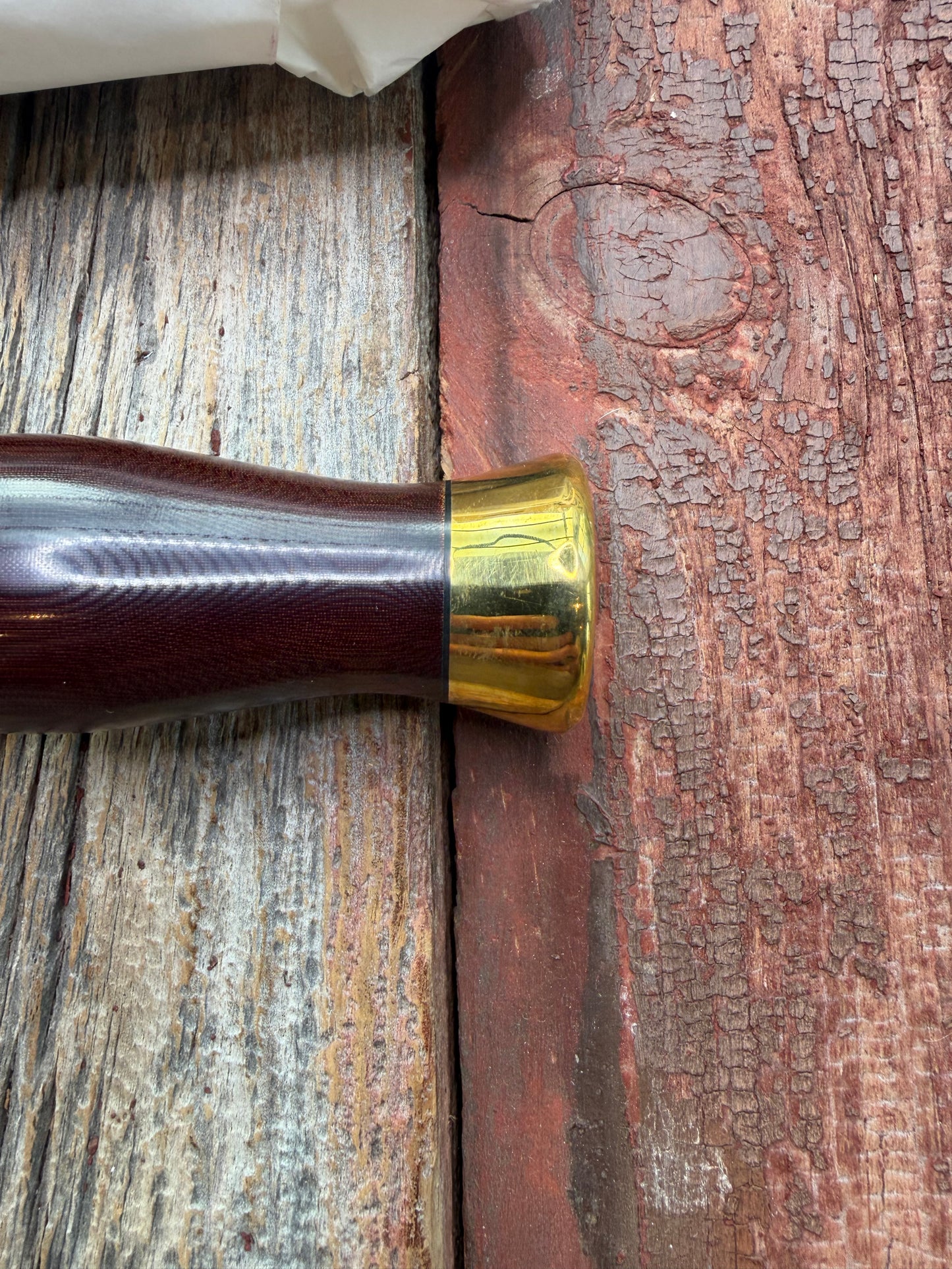 New in Paper Randall Model 12-8 Big Bear with a Maroon Micarta handle. Brass Hilt  and Brass collar, Carbon steel, brass butt cap.